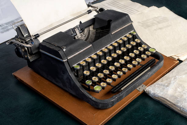 istock typewriter with Russian font with paper sheet. 998289782