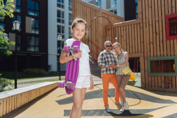istock Cheerful positive girl holding a skate 998290864