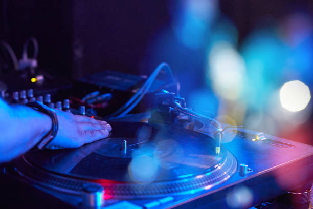 istock Closeup of a DJ keypad with vinyl records 998290914