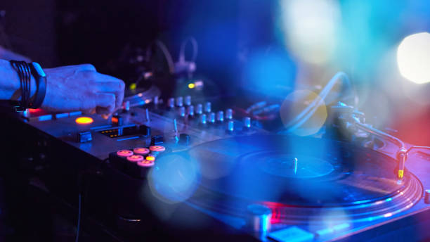 istock Closeup of a DJ keypad with vinyl records 998290924