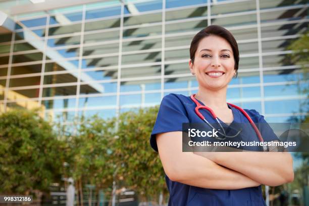 Smiling Hispanic Female Healthcare Worker Outdoors Portrait Stock Photo - Download Image Now