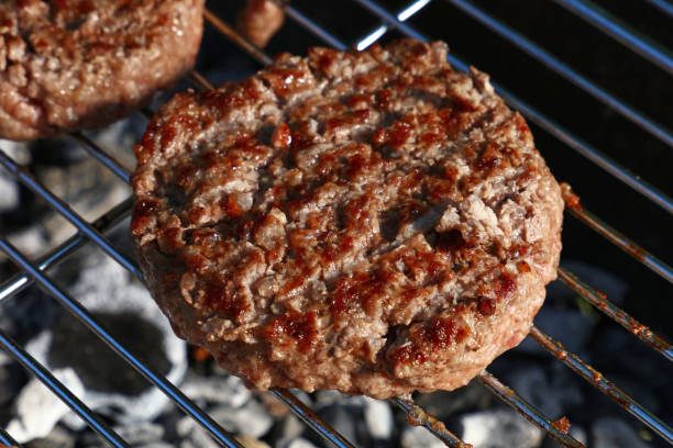istock Beef burger for hamburger on barbecue grill 998313304