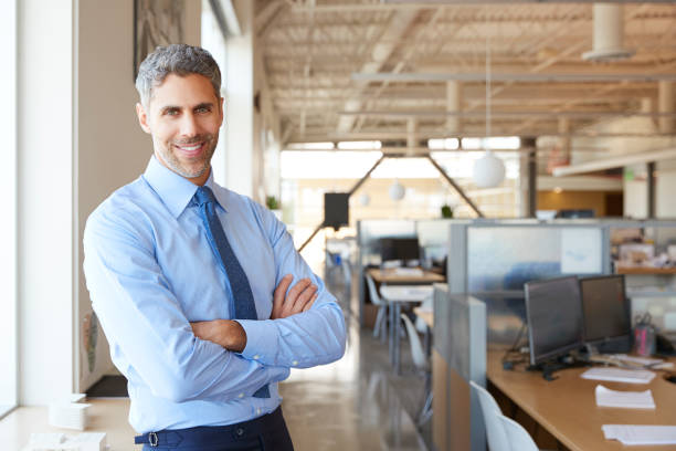 istock Smiling white male architect in office looking to camera 998315988