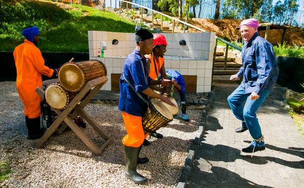 African Men playing traditional drums for Soweto township tourists Johannesburg, South Africa, April 23, 2013, African Men playing traditional drums for Soweto township tourists soweto stock pictures, royalty-free photos & images