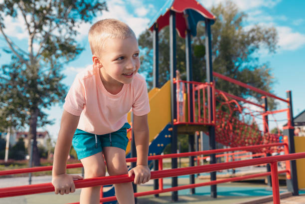 istock Happy little boy on children playground 998334412