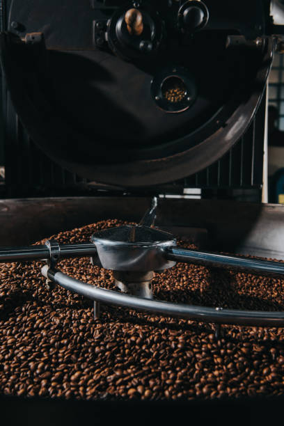 istock Roasting and mixing process in traditional coffee roaster cylinder 998336518