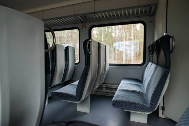 istock Empty interior view of modern train in Europe, rows of unoccupie 998338080