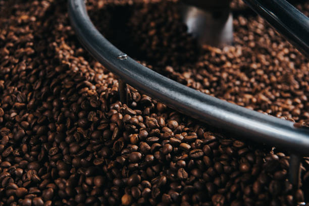 istock Traditional coffee roaster with coffee beans in cylinder 998338430