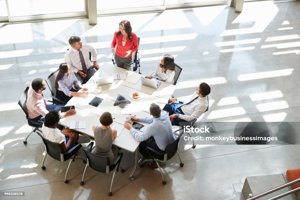 Businesswoman addressing team meeting, elevated view Meeting Stock Photo