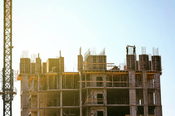 istock Builders workers install a plate for pouring concrete 998339268