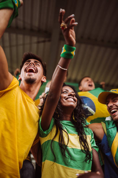 brazilian supporters have fun at the stadium brazil supporters have fun at the stadium international soccer event photos stock pictures, royalty-free photos & images