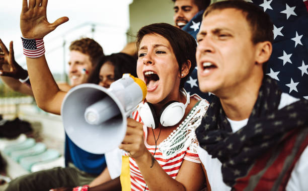 istock american supporter with flag 998359822