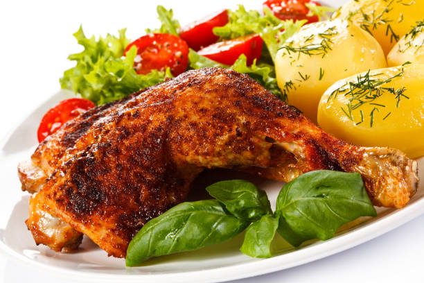 istock Roast chicken legs with boiled potatoes and vegetable salad 998364424