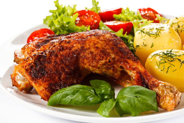 istock Roast chicken legs with boiled potatoes and vegetable salad 998366248