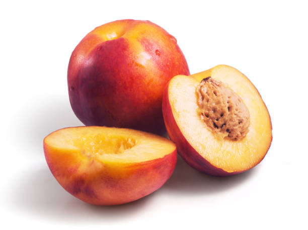 istock Group of fresh nectarines covered with water drops isolated on white background 998369000