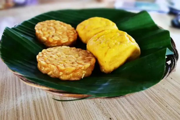 Tahu tempe, an Indonesian traditional food which served on a green banana leaf