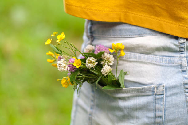 istock wild flowers in the blue jeans pocket 998372740