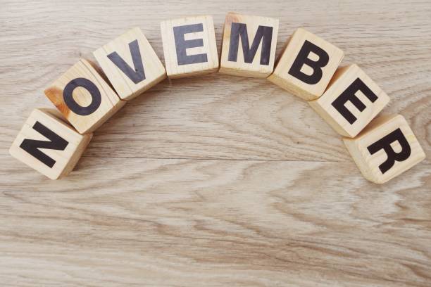 istock november alphabet letters on wooden background 998372776