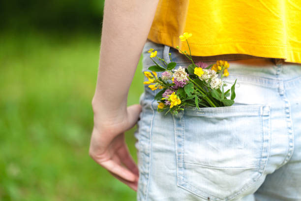 istock wild flowers in the blue jeans pocket 998372874