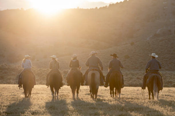 istock Horse riders side by side on horses 998378532
