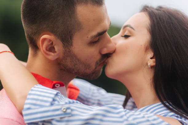 istock Girl hugs guy and smiles 998386164