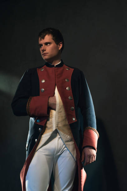 istock Serious historical regency man holds hand in jacket. 998390240