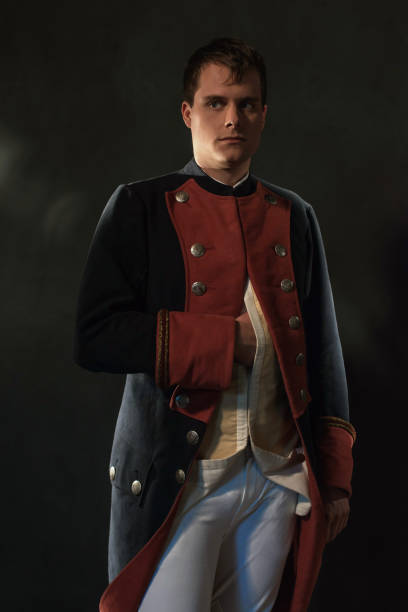 istock Serious historical regency man holds hand in jacket. 998390322
