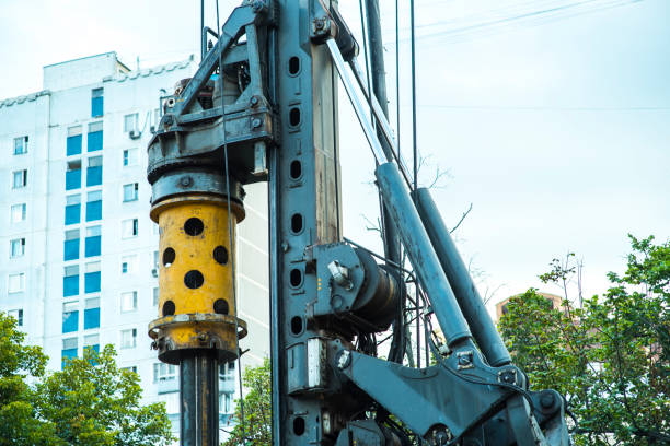 istock Drilling rig boring hole in city at construction site 998395630