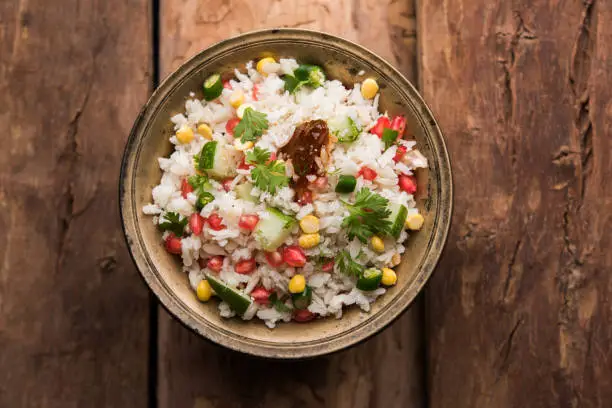 Photo of GopalKala or Dahi Kala is a prasad offered to lord Krishna on Janmashtami or Gokulashtami. Made using beaten rice, curd/milk, sugar, pomegranate, chilli , pickle and coriander