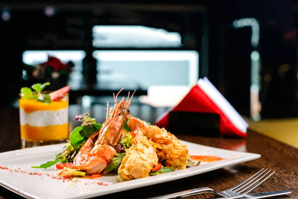 istock Delicious prepared shrimp with tomatoes, sauce and basil leaves 998408196