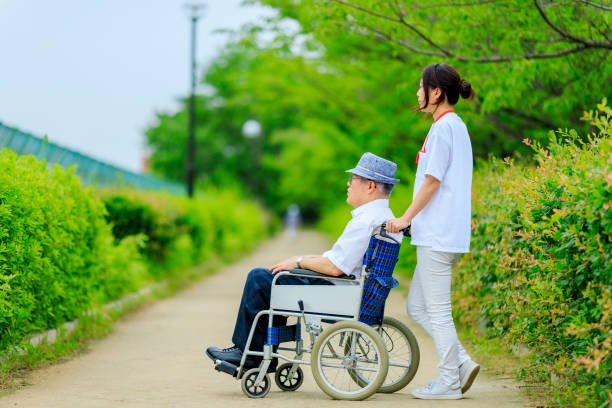 istock Elderly men riding in wheelchairs and caregivers 998411156