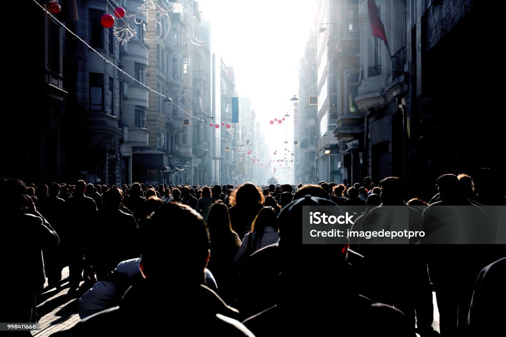 Crowd of people walking on busy street Close up image of crowd of people walking on busy street in Istanbul, Turkey Population Explosion Stock Photo