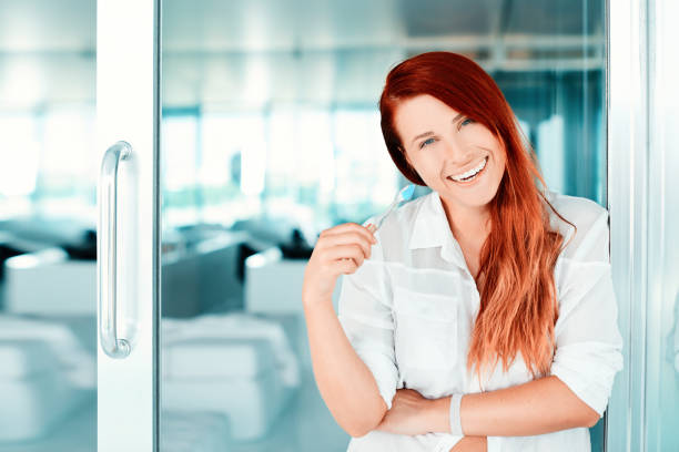 istock woman washing teeth 998414290