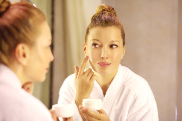 istock Magic anti-aging cream.Applying the cream 998414974