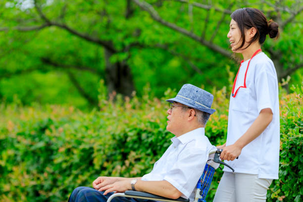 istock Elderly men riding in wheelchairs and caregivers 998416486