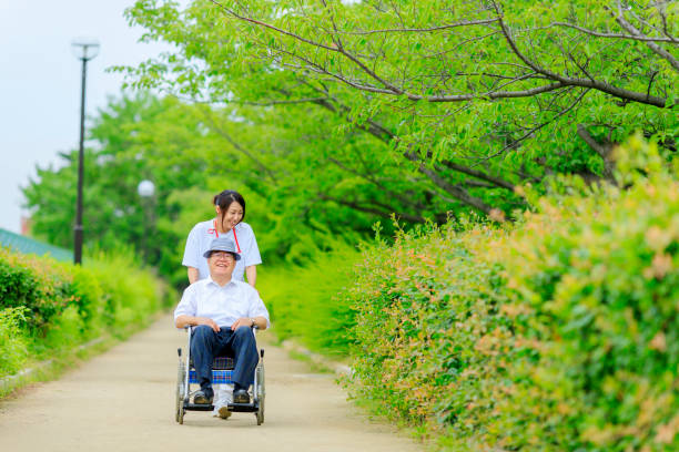 istock Elderly men riding in wheelchairs and caregivers 998419130