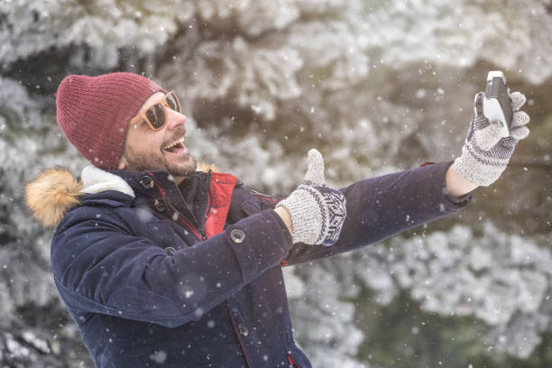 istock Cheerful man taking self portrait by using his smart phone. 998419288