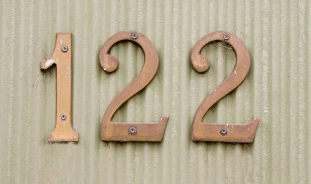 istock Close-Up Of Numbers On Wall 998428636