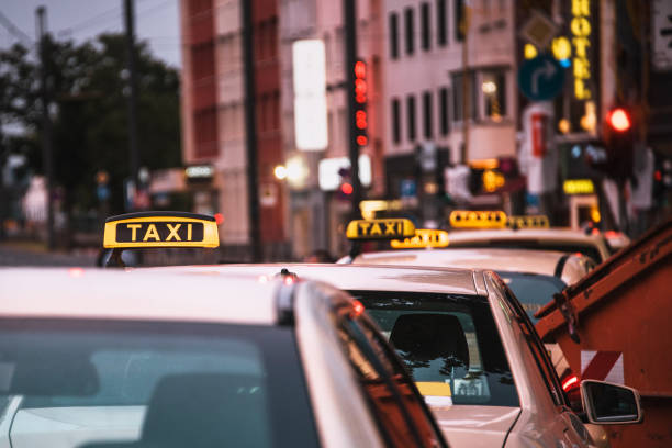 istock Row of taxis at night 998429098
