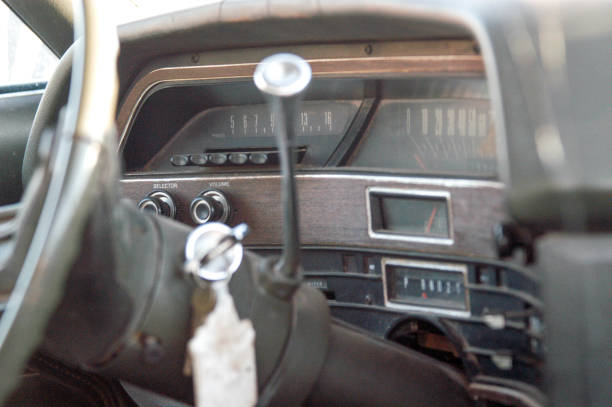 istock Dashboard of vintage car standing on wreckage junk yard, Oklahoma 998430222
