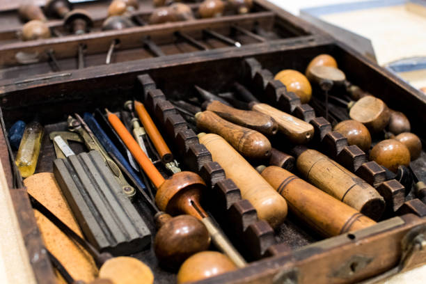 istock Antique tools for engraving and printing in a wooden case. 998432808