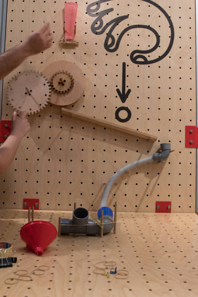 Wooden constructions to create a pipes path to a ball.