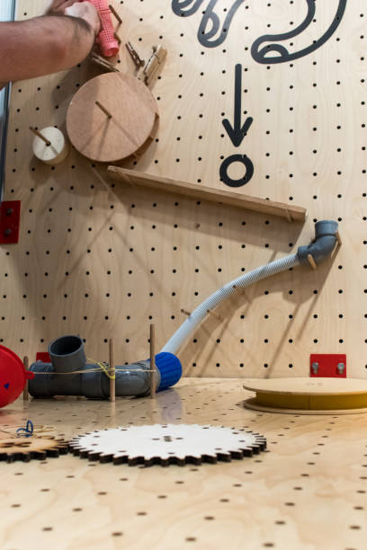Wooden constructions to create a pipes path to a ball.