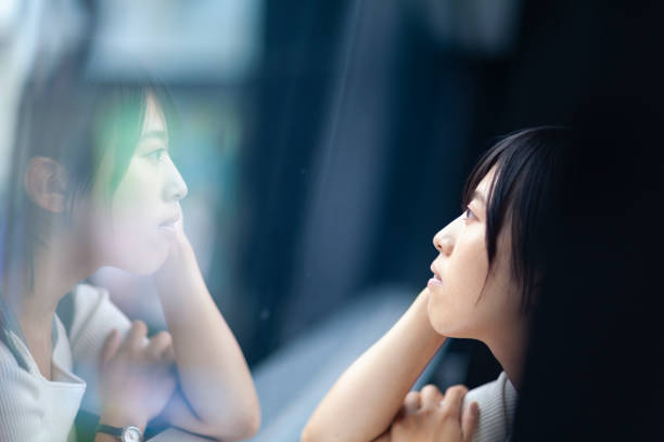 istock Woman thinking deeply by the window 998440120
