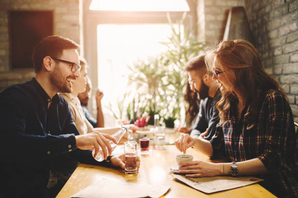 istock Happy colleagues from work socializing in restaurant 998443496