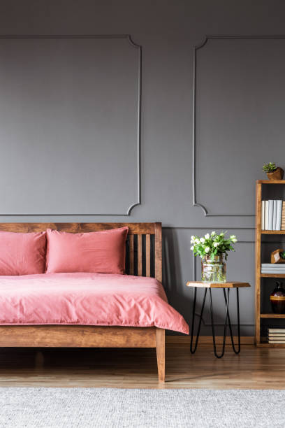 istock Pink and grey bedroom interior 998444358