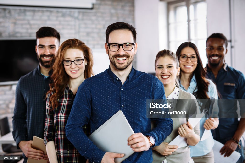 Portrait of successful business team posing in office Portrait of successful young business team posing in office Teamwork Stock Photo