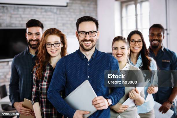 Portrait Of Successful Business Team Posing In Office Stock Photo - Download Image Now