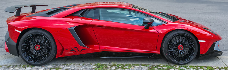 Rome, Italy - April 29, 2011: Front view of a red Lamborghini Aventador LP-700-4 parked on a street.