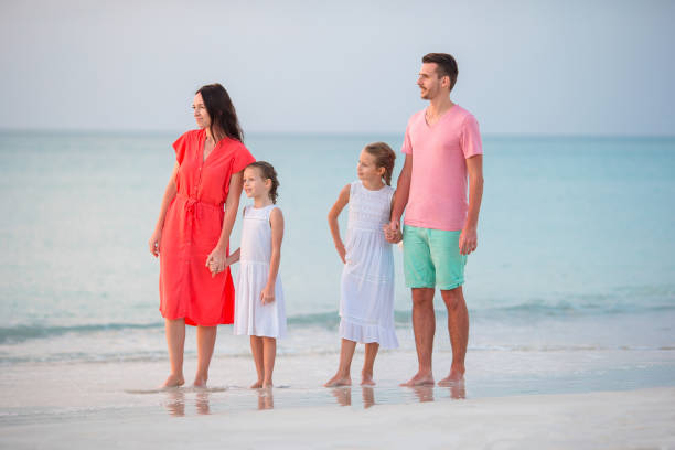istock Happy beautiful family on the beach 998457656